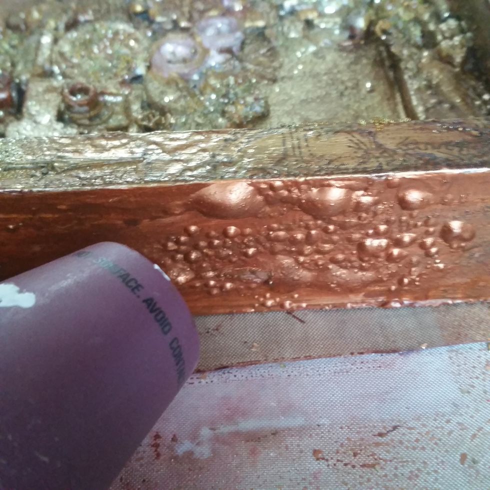 I then used my heat gun all around the project up close to create air bubbles for even more texture.