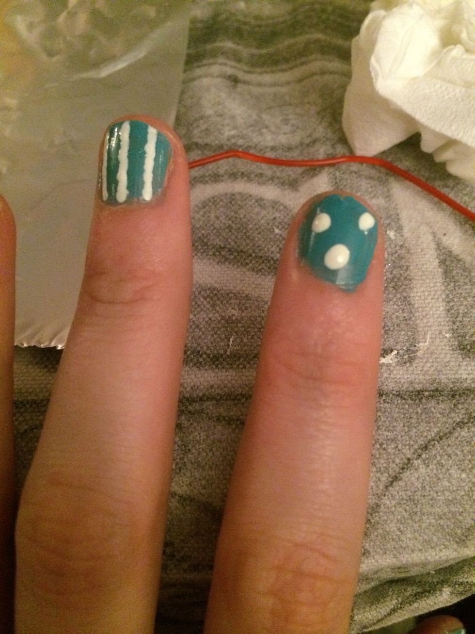 I then used the white nail brush to do random dots on my nails. I did three but you can do however many you want.