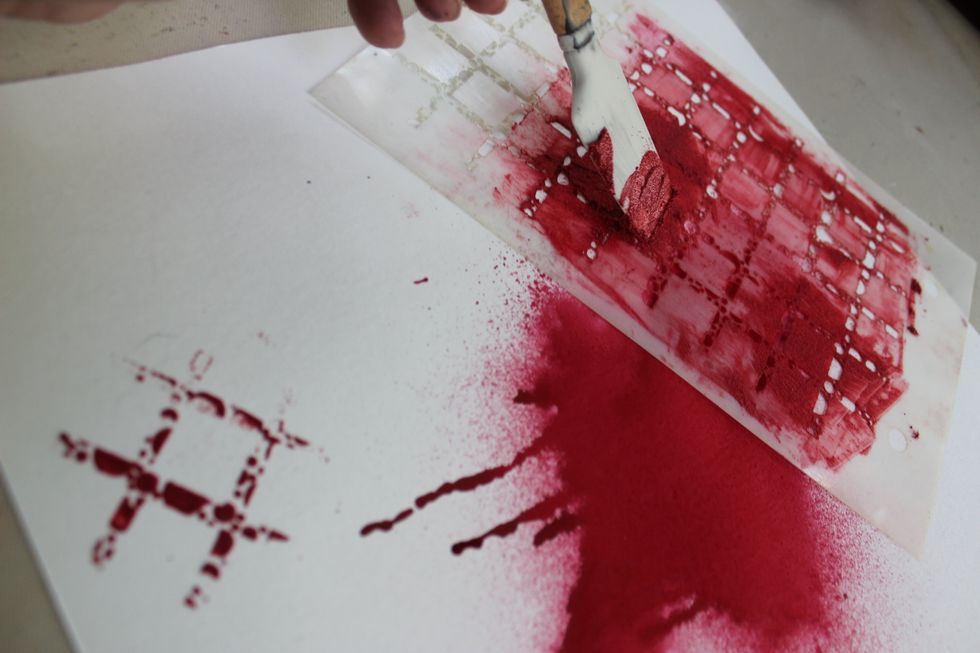 I then went ahead and added a few spots of the image from the stencil on other areas of the 12x12 sheet.