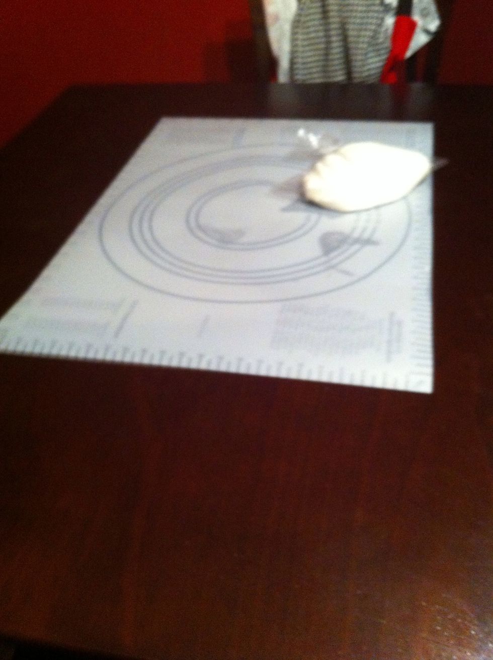 I thought my table would be this clean throughout this process! Boy was I wrong! :)  Powered your area with confectioners sugar before you began rolling the fondant.