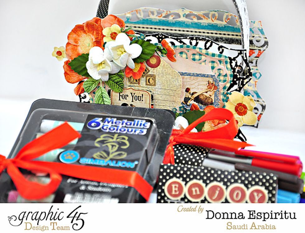 I tied the coloring pens and pastels with a ribbon.