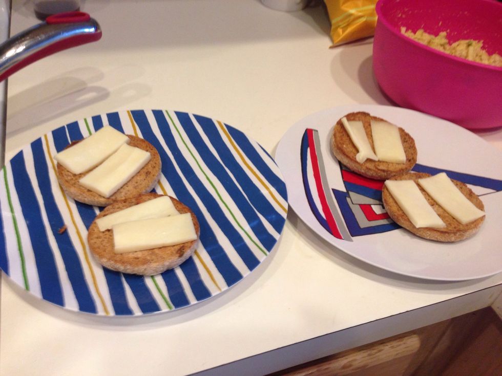 I toasted some whole wheat English muffins (any bread will work) and I added 2 slices of jack cheese (cheddar or any other cheese will be delish as well) to each slice.