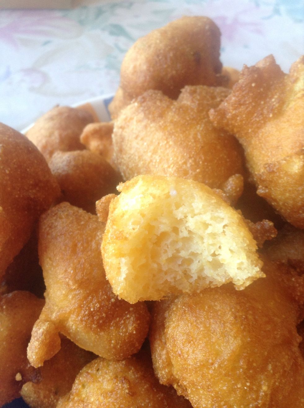 I took a bite so you can see what the inside looks like. You're welcome! These are so yummy! We had them as an appetizer at our party. They're also a good side for fried fish or fried chicken. Enjoy!