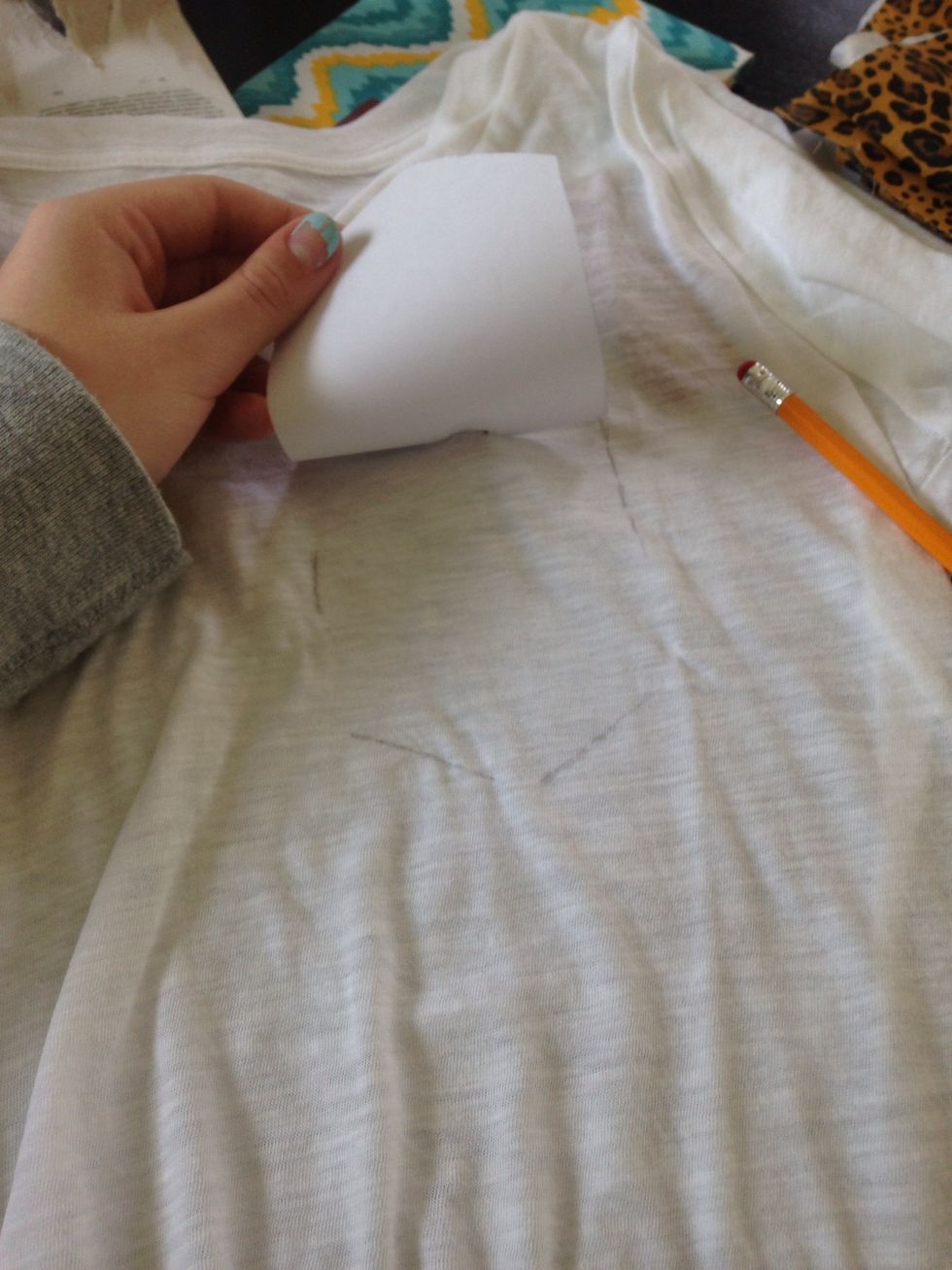 I took off my shirt and traced my template that I cut out. Don't trace the out side part. The outline just shows where your placing the pocket later.