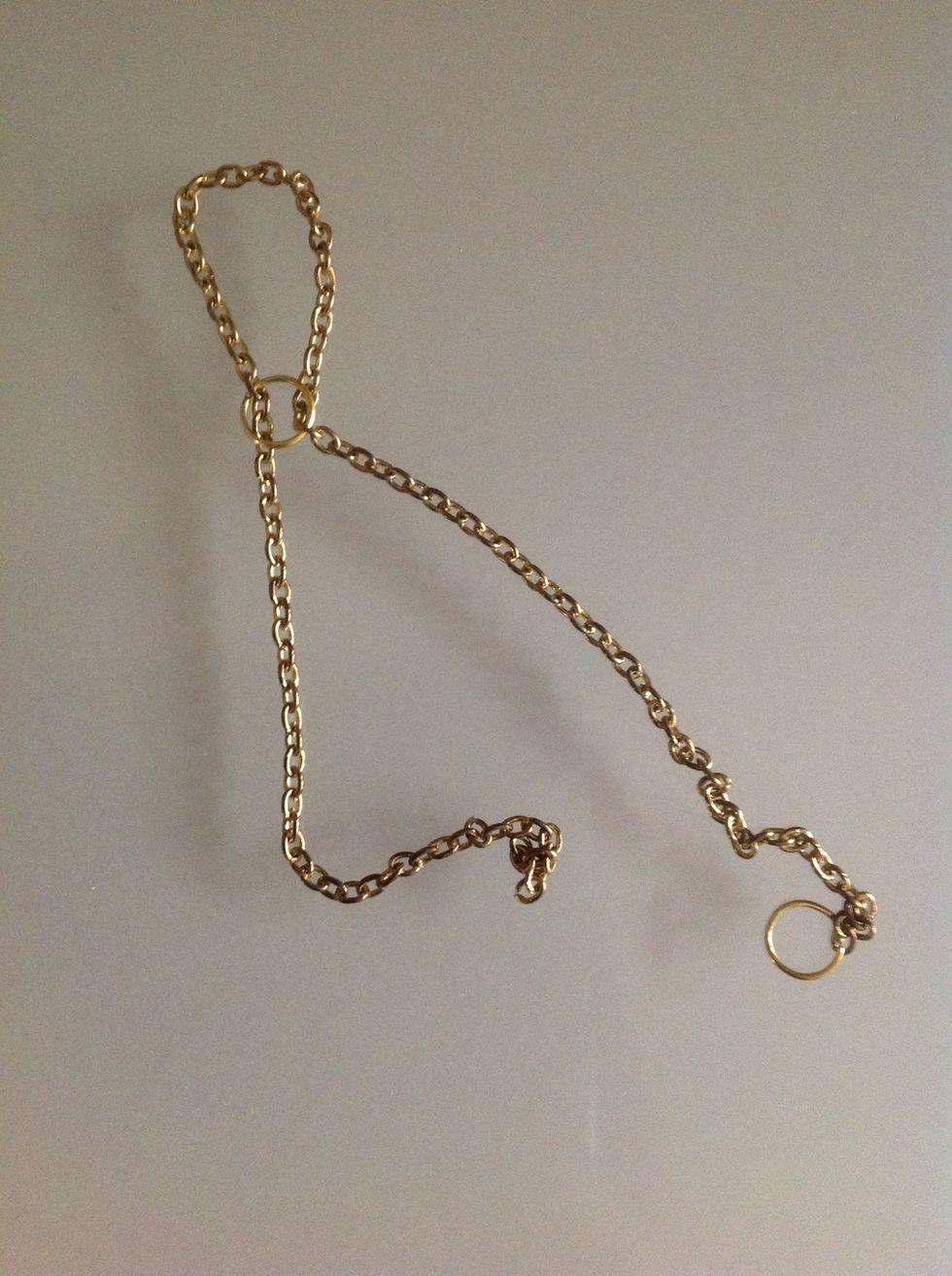 I took the chain, put it around my middle finger, n put a jump ring so as to form a ring. And the two equal dangling parts I measured till my wrist, where they would join the bracelet.