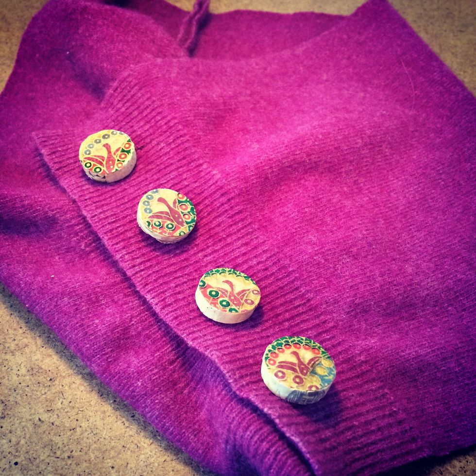 I turned a felted wool sweater into a loose scarf then added the buttons to make it more interesting. The buttons are pretty nifty!