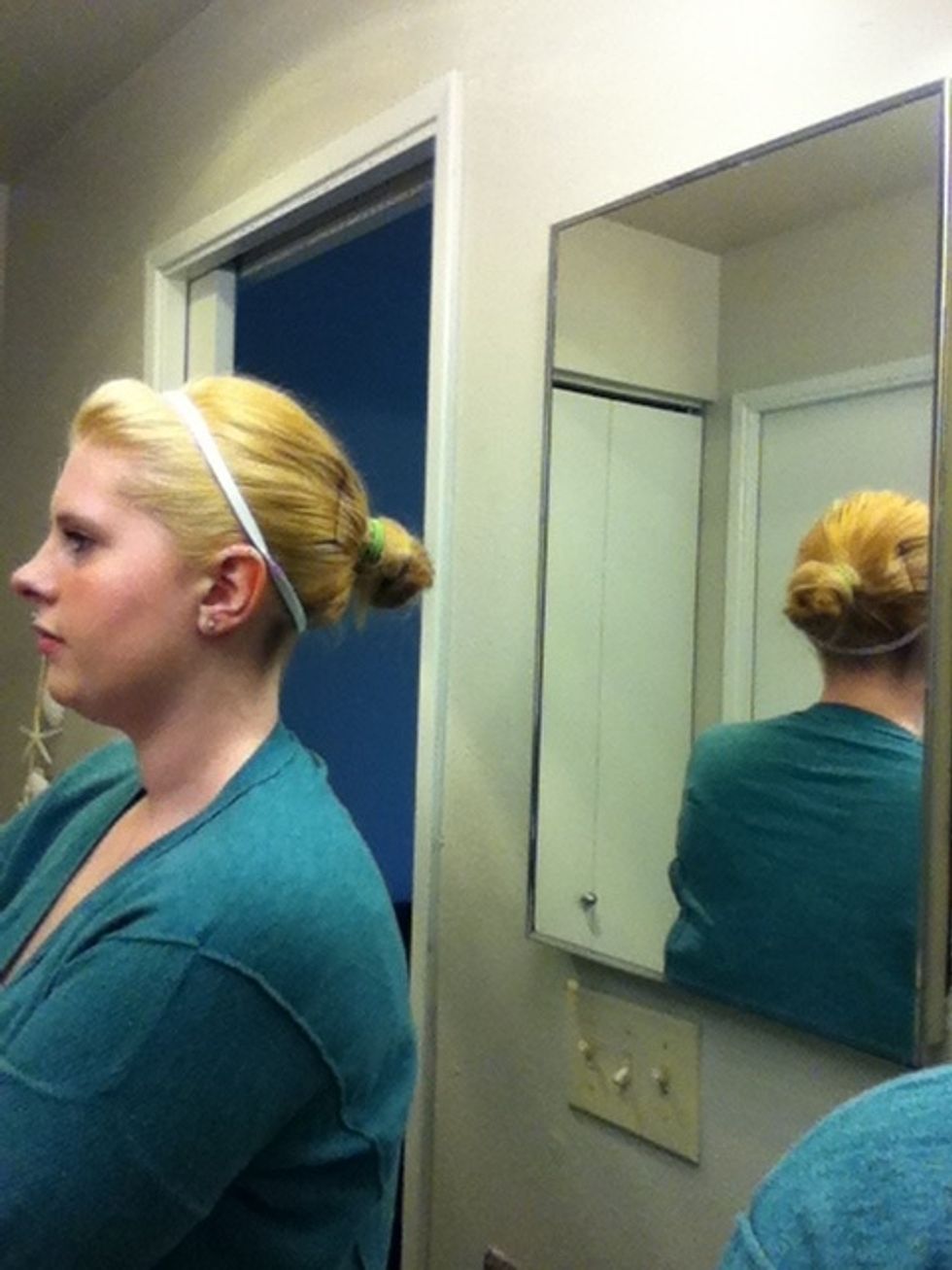 I typically add a headband, but you can accessorize any way you'd like. Use bobby pins and hairspray to secure your stray hairs.