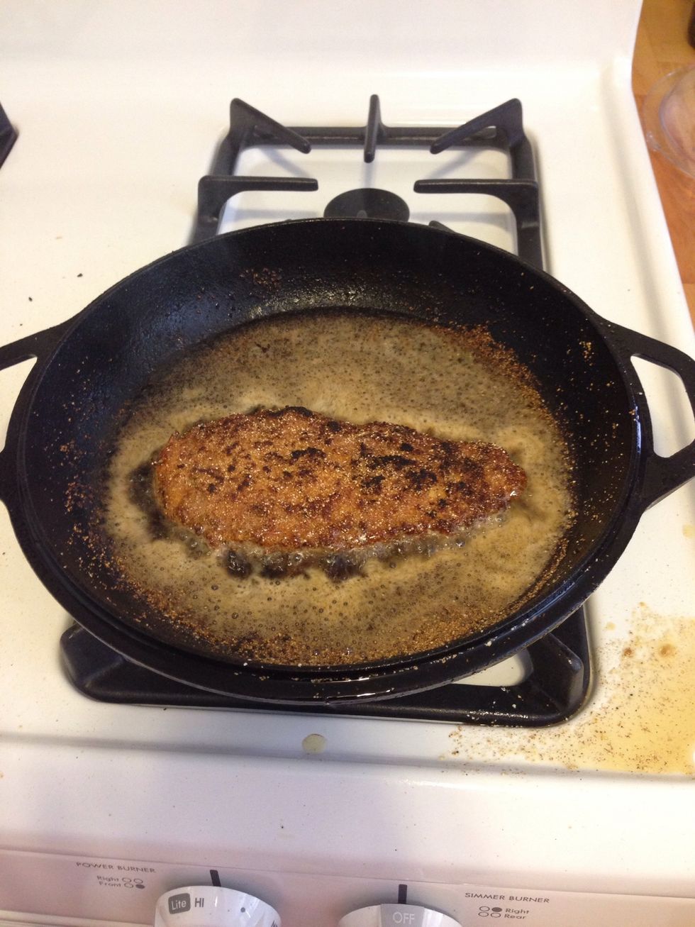 I use a cast iron skillet and a gas stove, so I cook the chicken for about 2 mins on each side. Other stoves might need longer. Cook until the crust is golden brown.