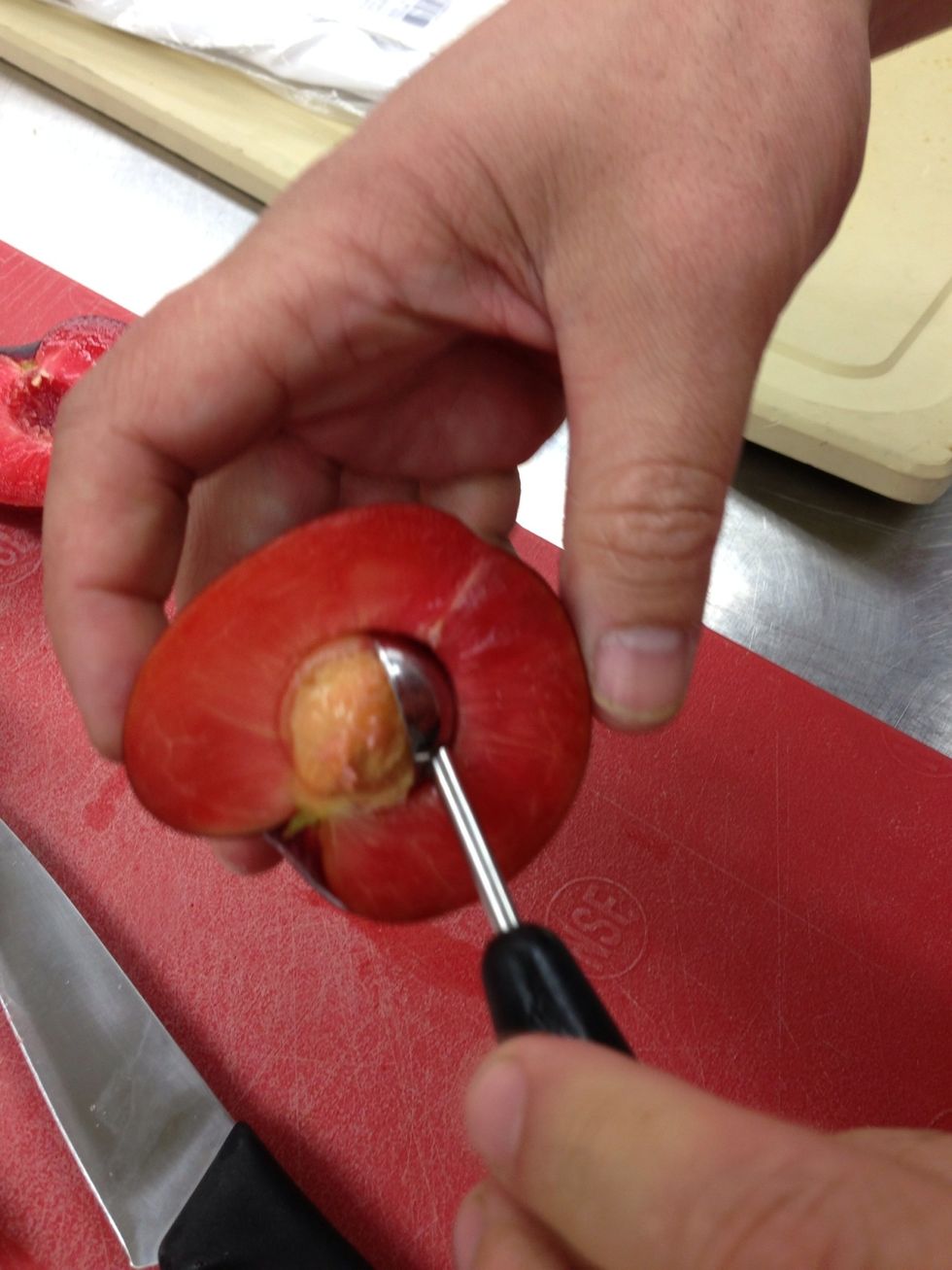 I use a melon baller to remove the pit