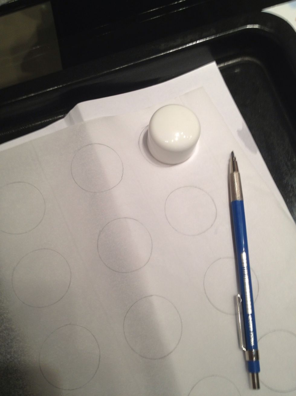 I use a pencil tracing a cap that is a size i want for my macarons.