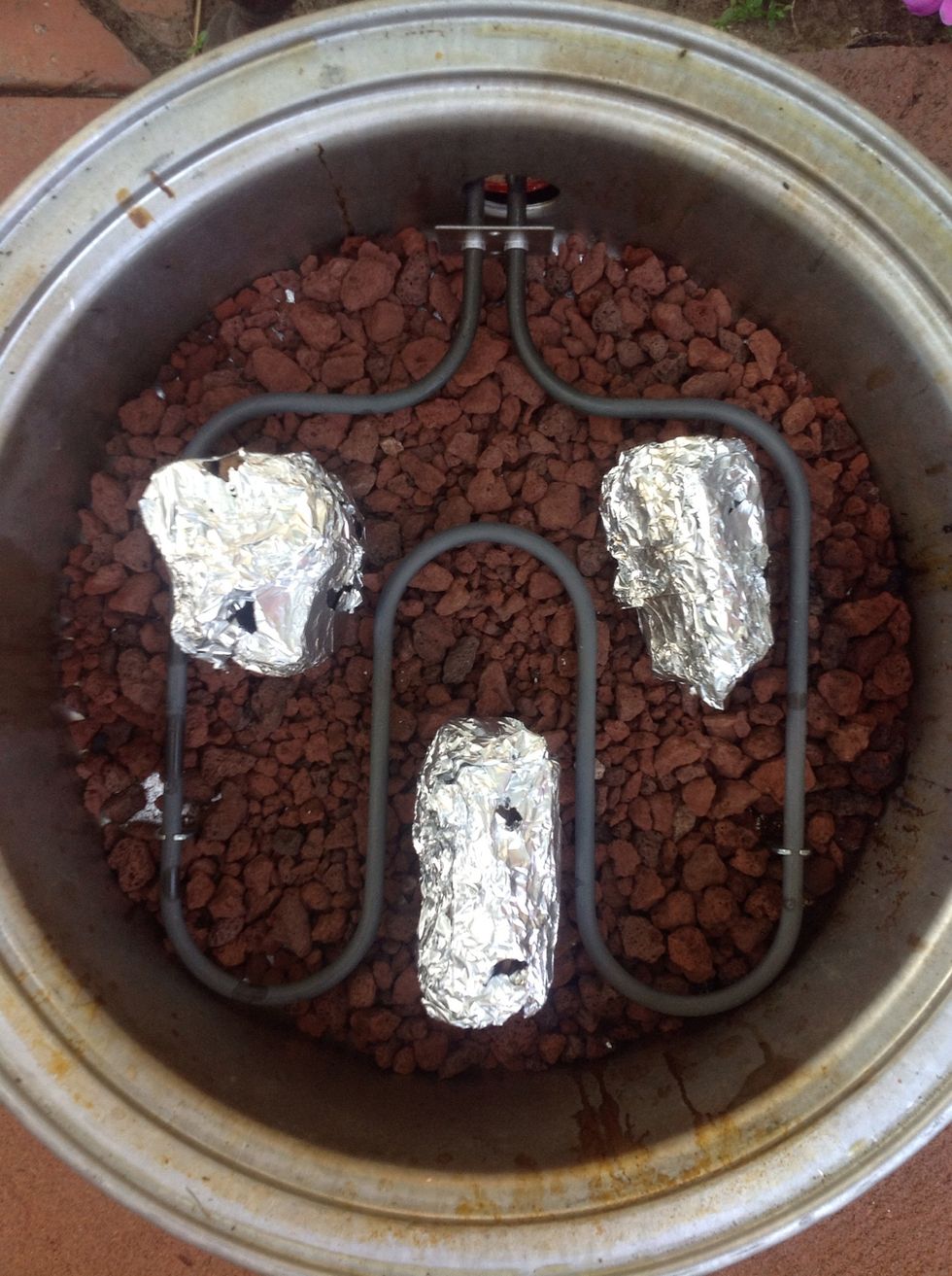 I use an electric smoker and wrap my pieces of hickory in foil to create a better smoke. Make small holes in your foil to release the smoke.