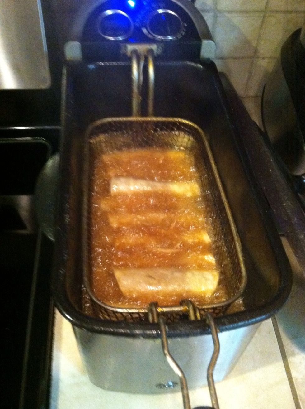 I use my deep fryer, but you can just add about half a cup oil in a pan and fry them that way.