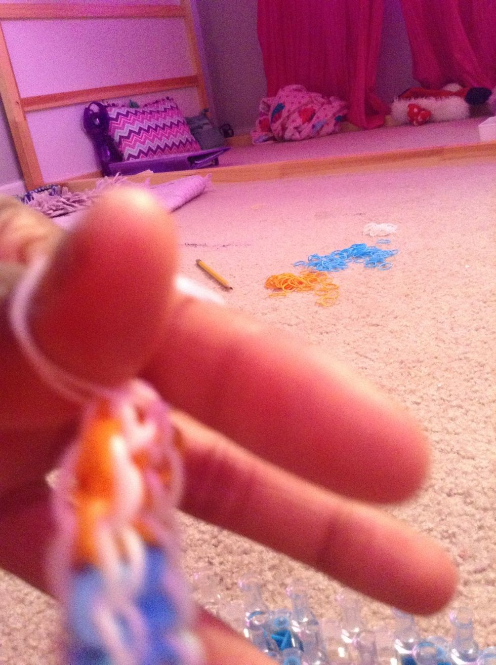 I use my fingers when I add the Extension but you can do it on the loom.