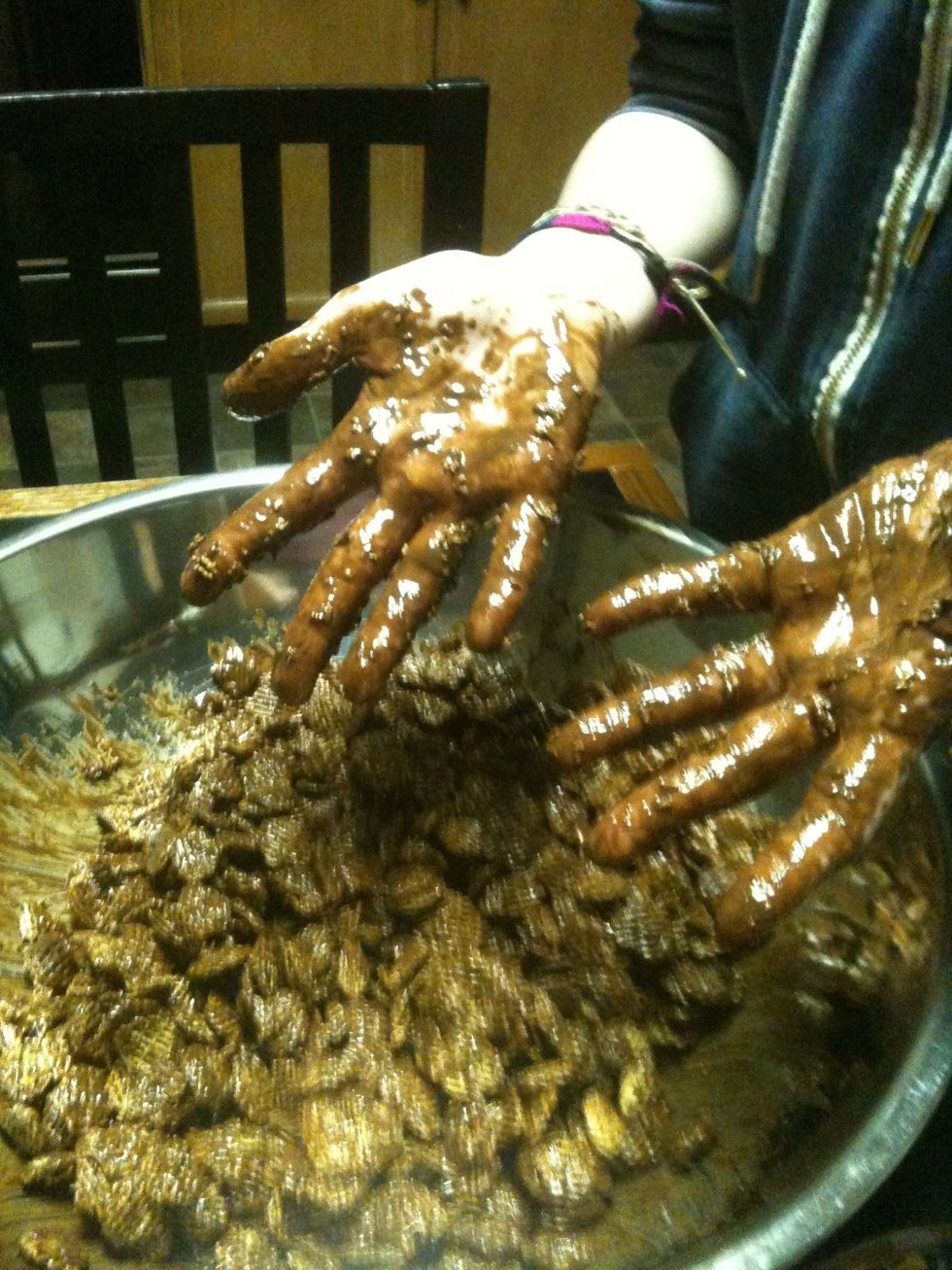 I use my hands, but big spoons work well too.