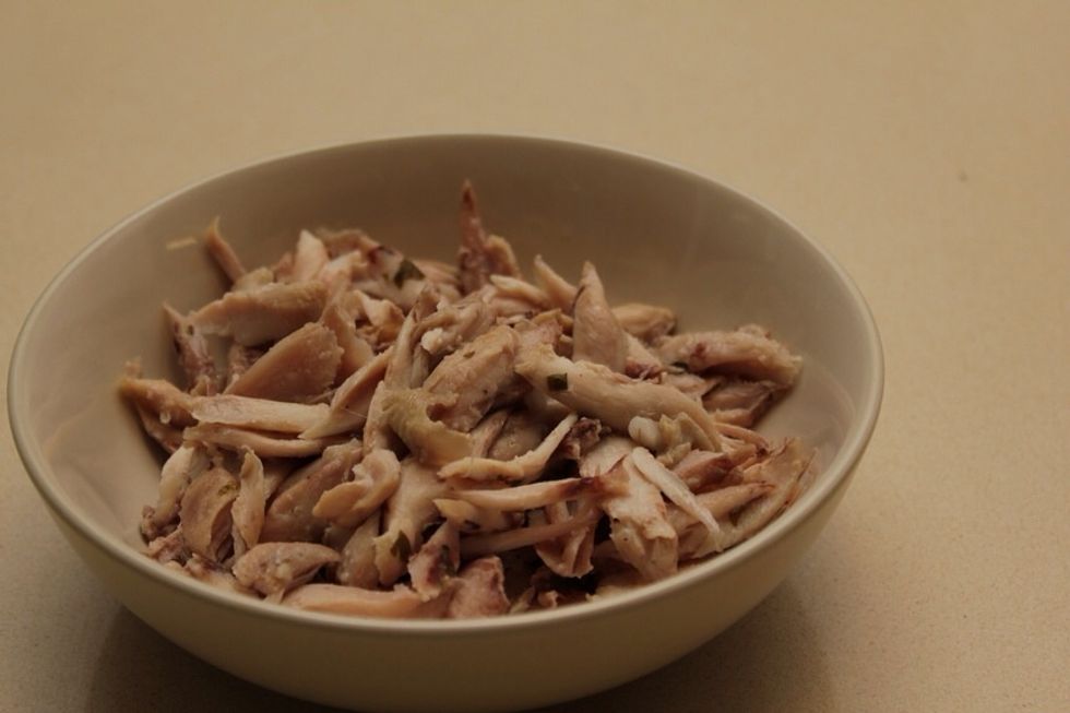 I use pre-cooked chicken wings, usually left-overs from the preparation of soup or broth. Dimantle the wings into small chunks of meat.