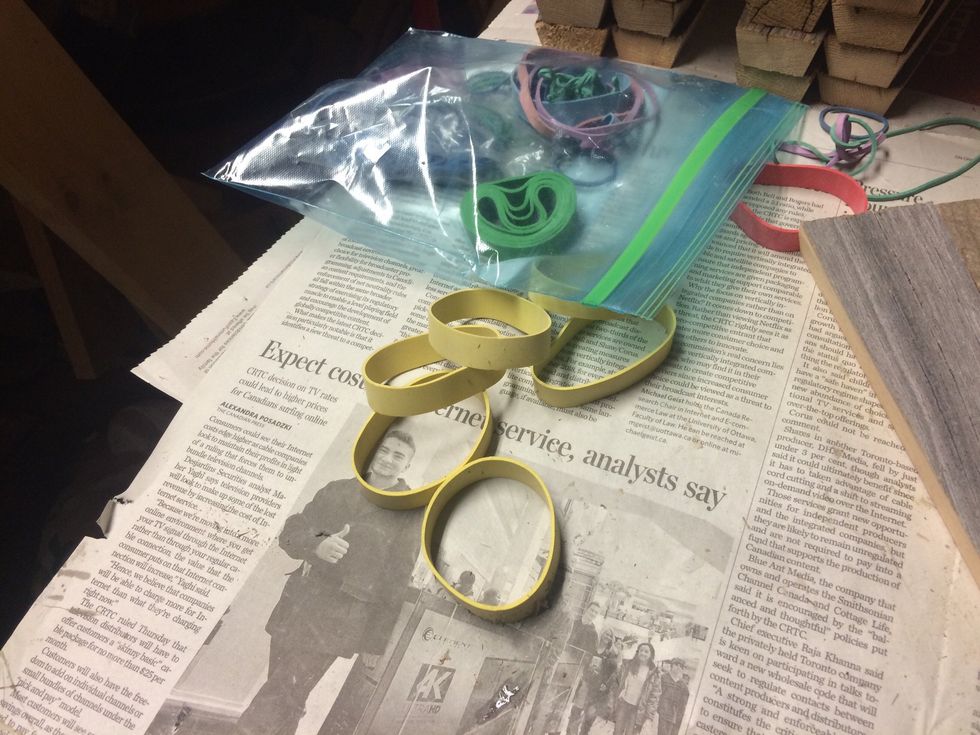 I use rubber bands to keep the buckets together while the glue drys.