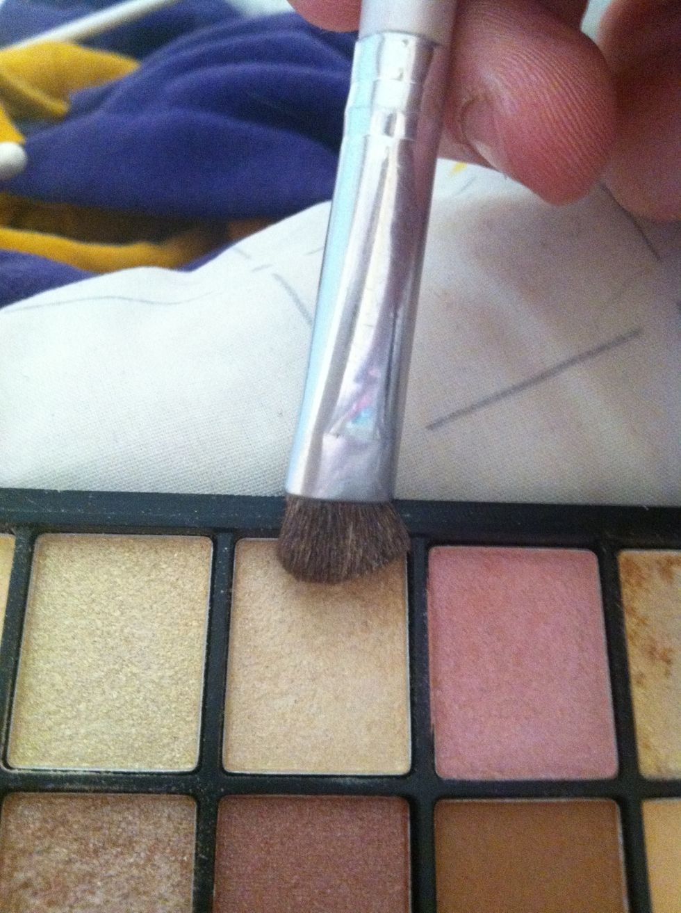 I use this nude shimmer color for my lid. ELF palette. Flat brush.