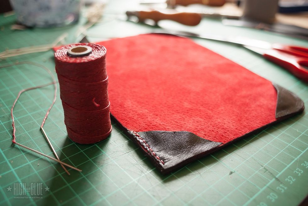 I use waxed thread, 2 needles (similar to these) and a sewing awl to sew these pieces of leather together. Check out my hand sewing tutorial if you don't know how to sew a project like this.