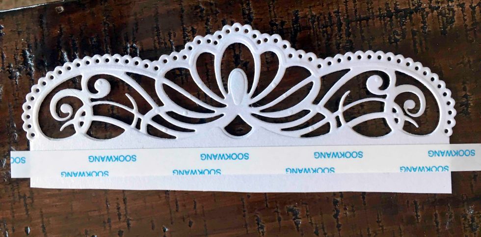 I used 1/2" wide Scor-Tape to other front of the border and tape it to the back of the 3" scored fold.