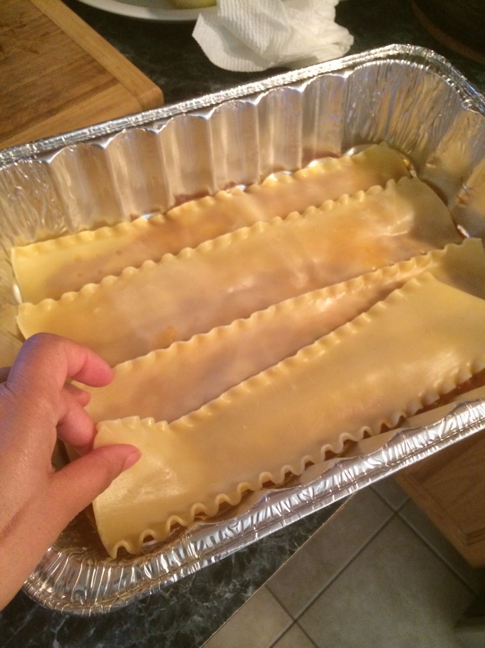 I used 4 noodles for the bottom of this lasagna overlapping each one.