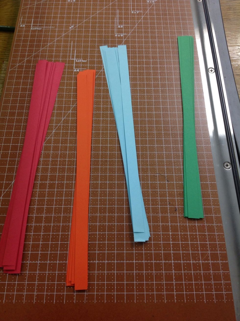 I used 8 1/2 x 11 colored paper for ease of distinguishing the steps. You can use any kind of paper you choose. But you need thin paper that you can fold easily. I cut mine to .25 inch thick strips.