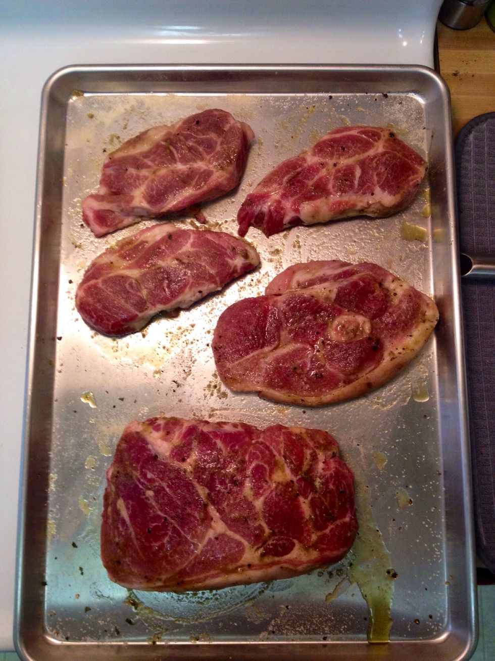 I used a 3 pound Boston butt roast (front) that I got on sale for $2.26! Plus a couple of random cheap chops that I had in the freezer. Season meat both sides with salt, pepper, sage, & olive oil
