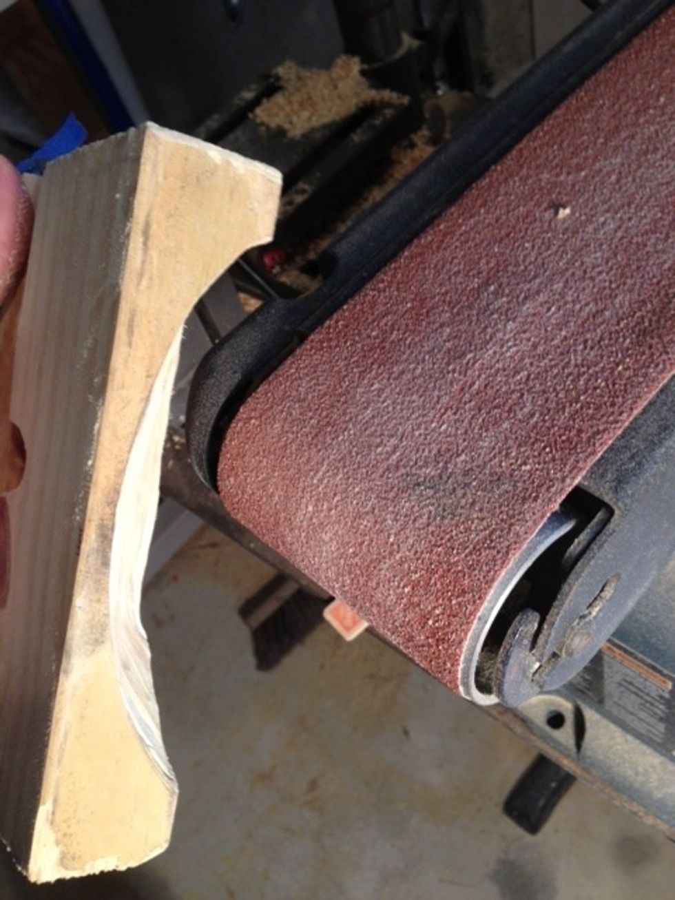 I used a belt sander to massage the wood to my likening. It was a bit tricky wear gloves, remember safety's third ...unless you mess up.