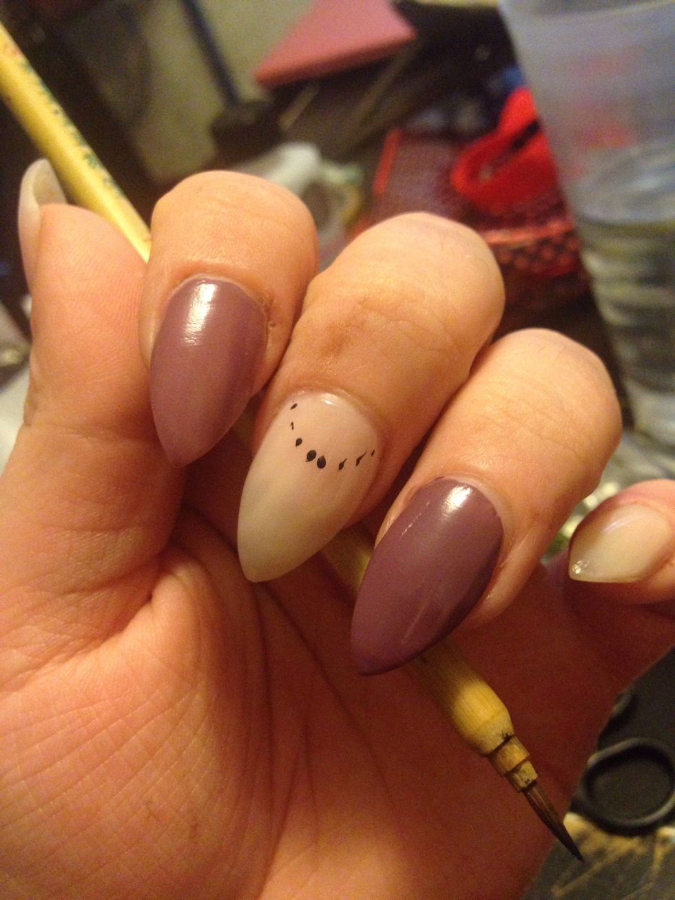 I used a brush and made a few does outlining my half circle.