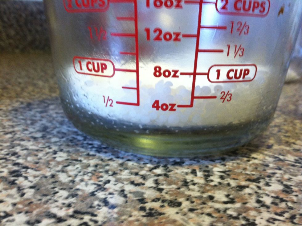 I used a Dixie cup (approx. 4 oz.) & filled it with beeswax pearls. Pour in measuring cup