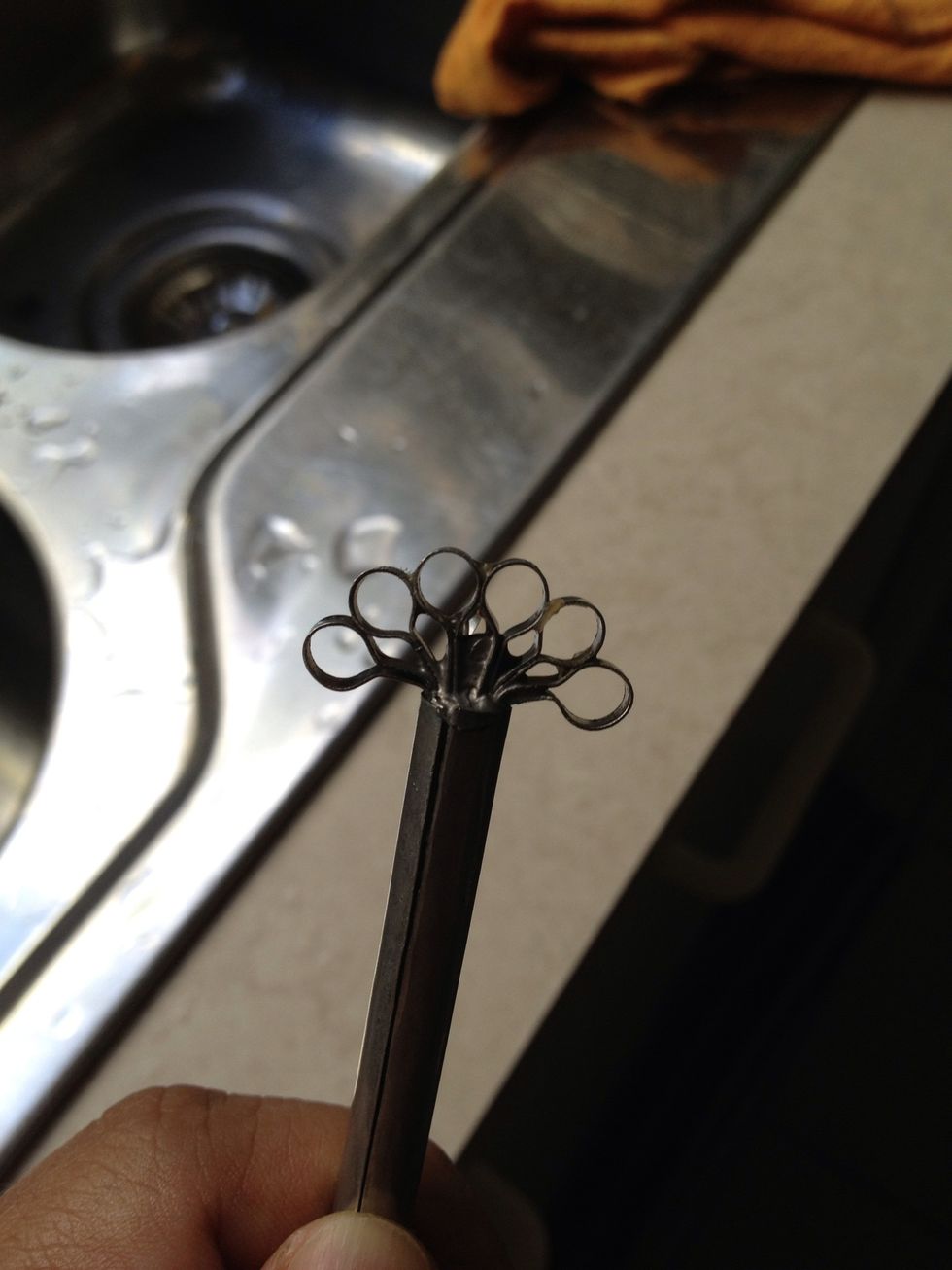 I used a melon scraper. You could also use a grater, or even just use a fork, but it will be messier.