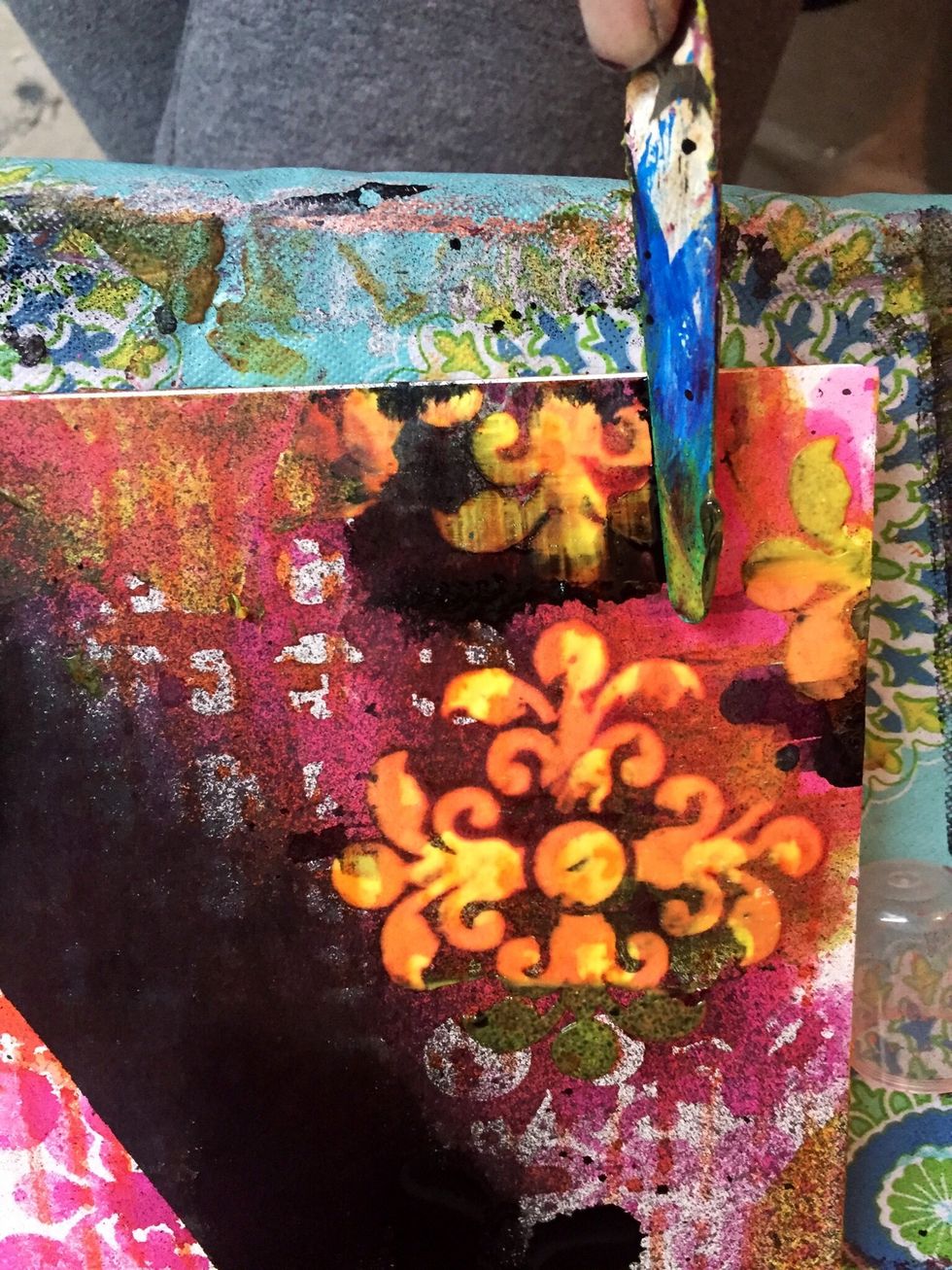 I used a palette knife and scrape off the Rossettes revealing unique colors underneath.