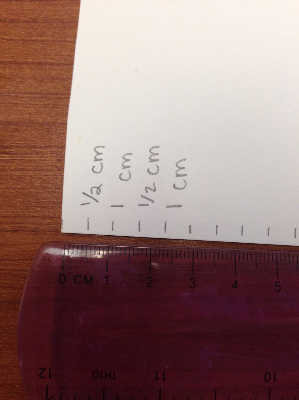 I used a paper shredder to create our strips which are 1/2 of a cm. To make your outside frame you need to double that.