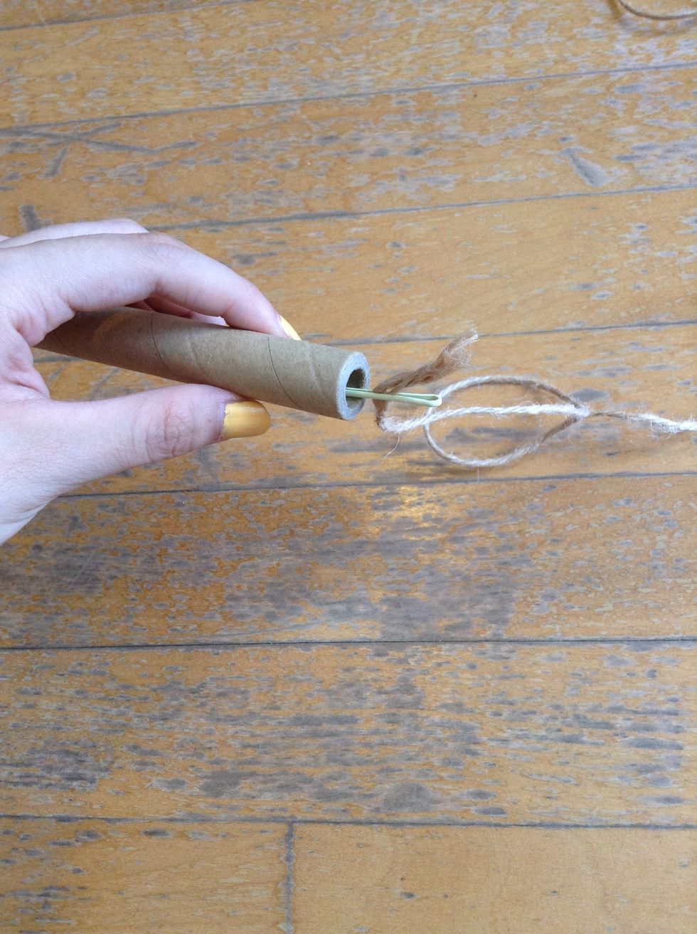 I used a pin to make my job easier. You can use anything that is slim and has mass.