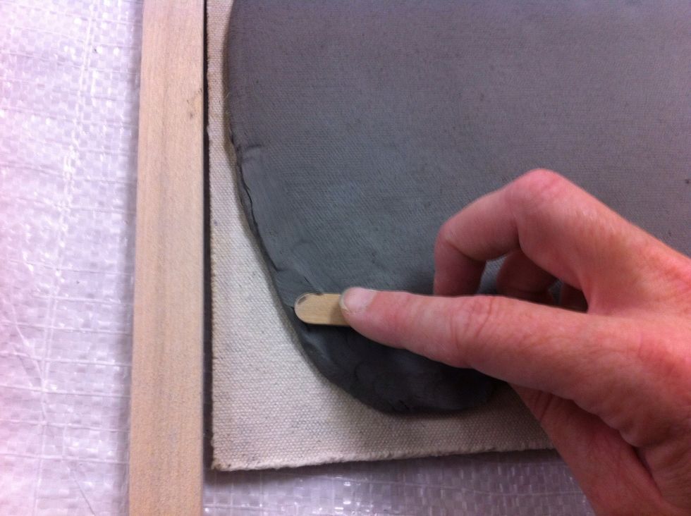 I used a Popsicle stick to smooth out the seam where I added clay.