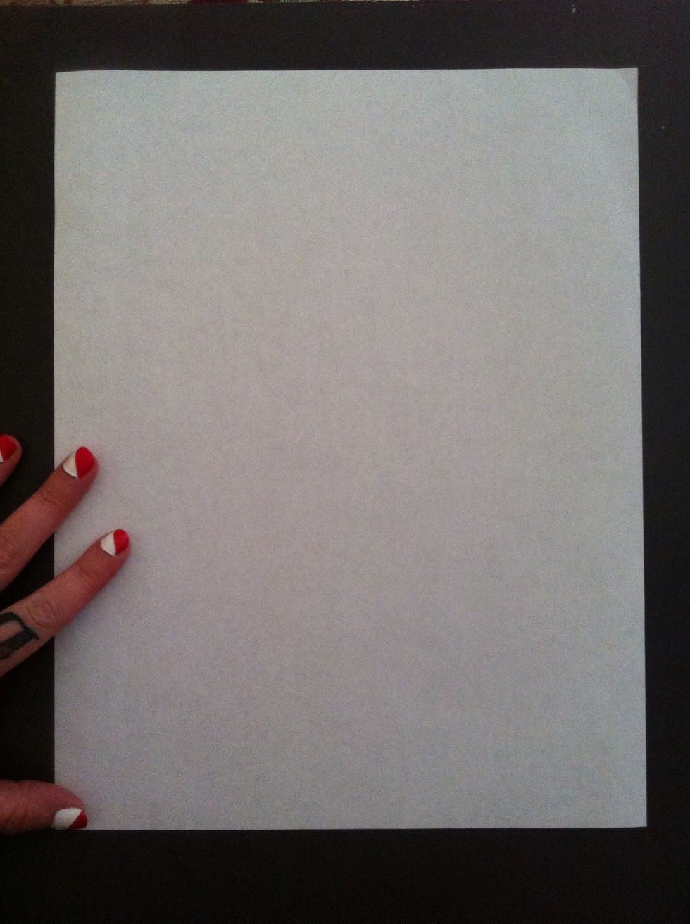 I used a sheet of printer paper. I do not recommend construction paper because it does not hold up well with repeated folding.