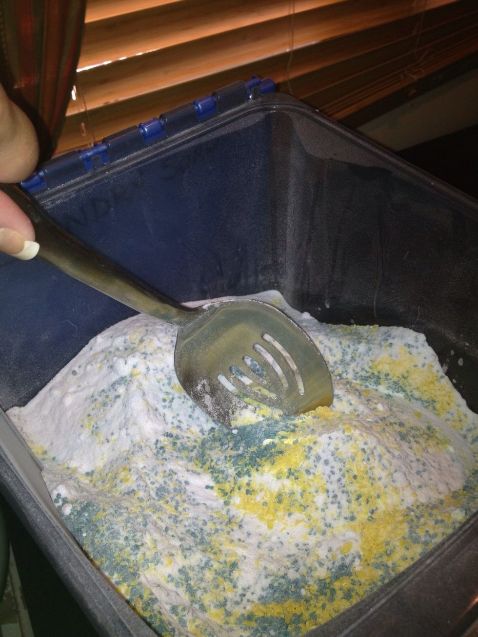 I used a slotted spoon because it seemed to make it go faster. The adding ingredients & mixing will be messy & smelly. The particles are small and become airborne easily. There will be some cleanup.