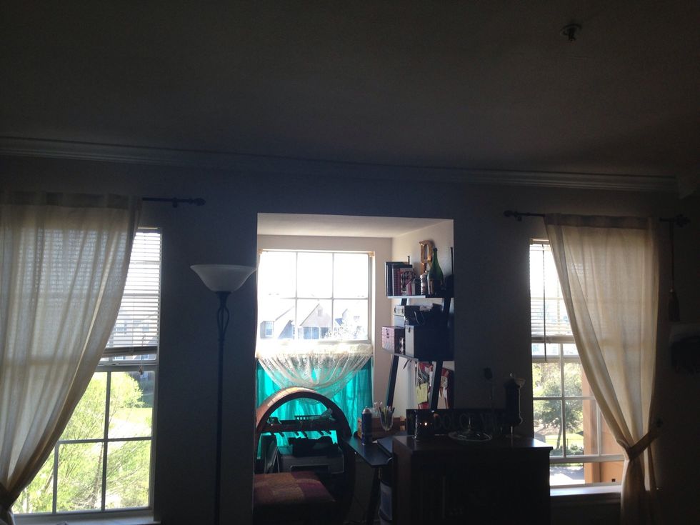 I used a space that had a focal point for my one of a kind curtain rod transplant decor. By accident, they looked like two arrows pointing inward to my focal point, my nook.