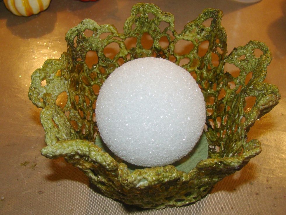 I used a Styrofoam ball for the inside to provide height, but you can also crumple up paper which would be more cost effective. Glue to the  inside bottom of the basket.