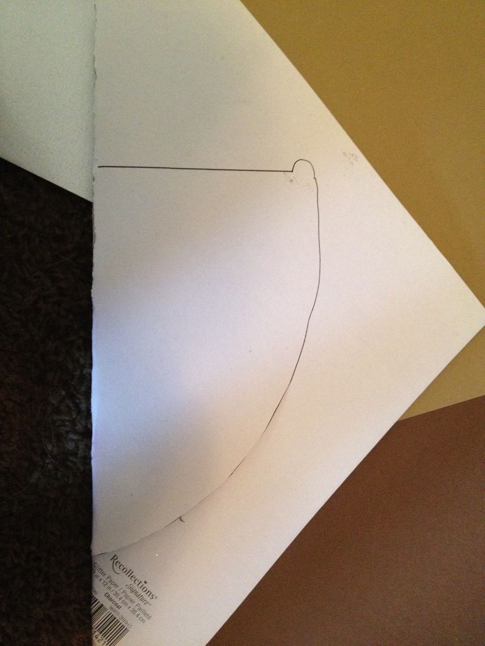 I used a template from google images to trace the outline of the spade on my glittery paper. then I cut out the spade.