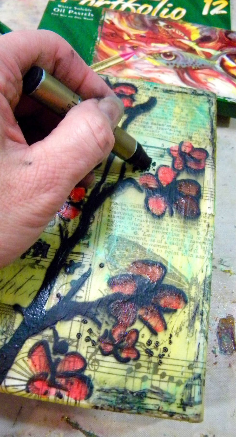 I used another hoarded supply, a black oil pastel, to fill the dots. I also smeared it around for shadows.