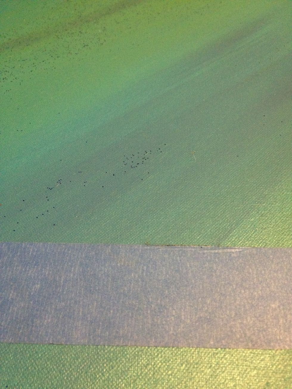I used blue tape, so as to not pull up the paint, to make a stripe at the top and bottom of the painting, about four inches from both sides.