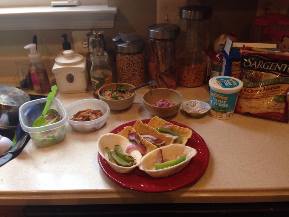 I used both soft and hard taco shells. First add your grilled veggies, onions and bell pepper.