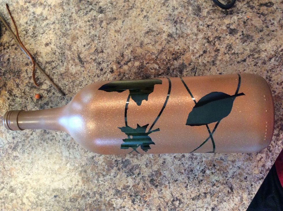 I used brown as my base, then lightly sprayed orange and finally used an orange glitter spray. Wait about ten minutes to dry and remove the tape and rubber bands.