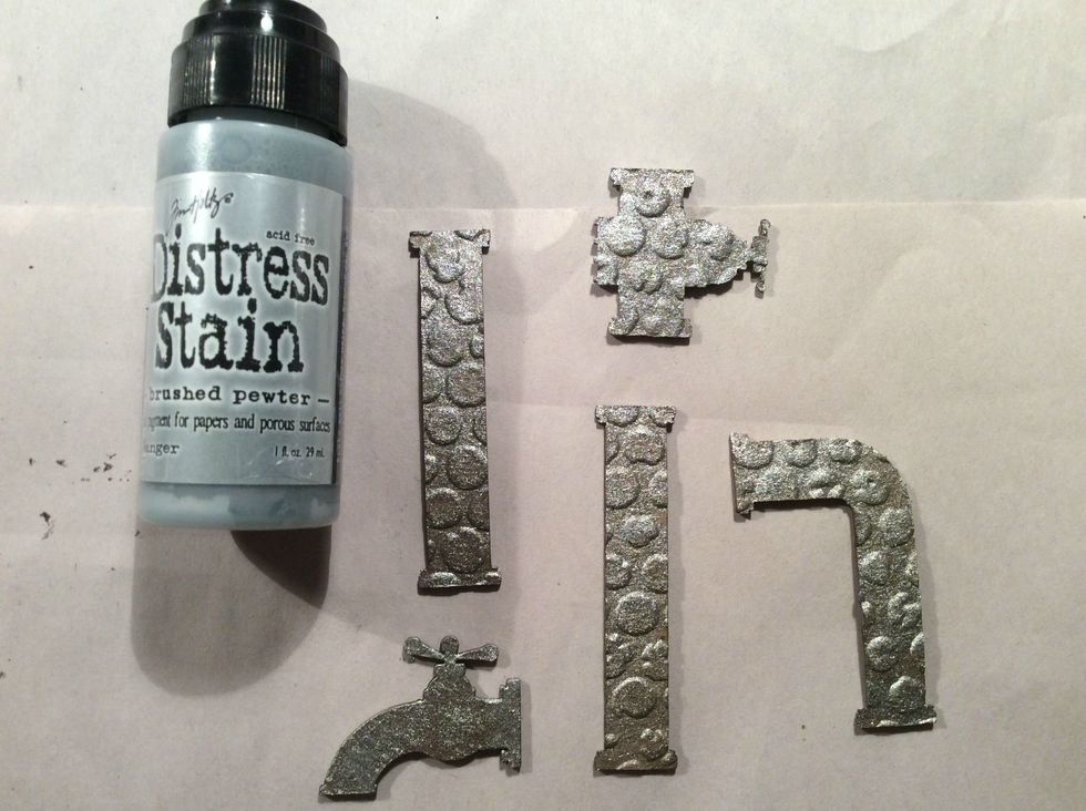 I used DI Stain in Brushed Pewter and once dry I dry brushed black gesso, or you can use blace acrylic lightly over the top.