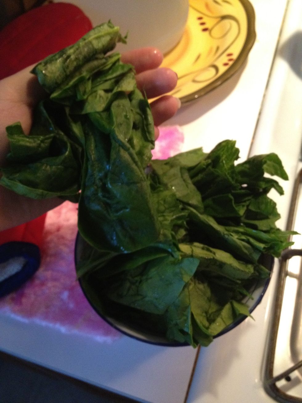 I used half a bunch of spinach, again..use however much you want. Remember to wash, get most excess water off, break off stems & rip in half.