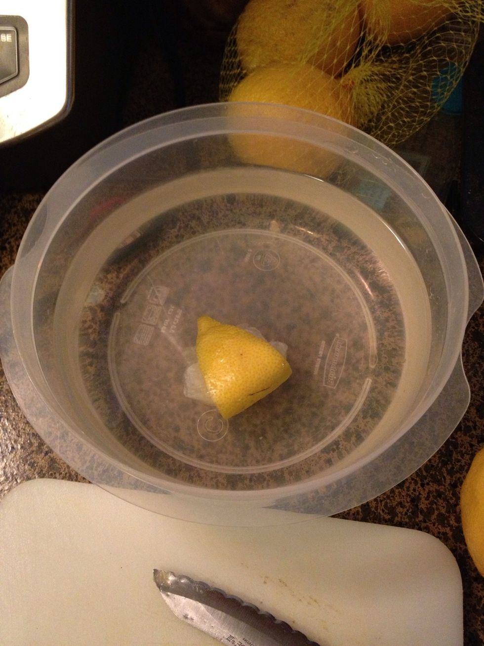 I used lemon. I did a good squeeze in the water. Or use a spoonful of Citric acid or Fresh Fruit in the water.