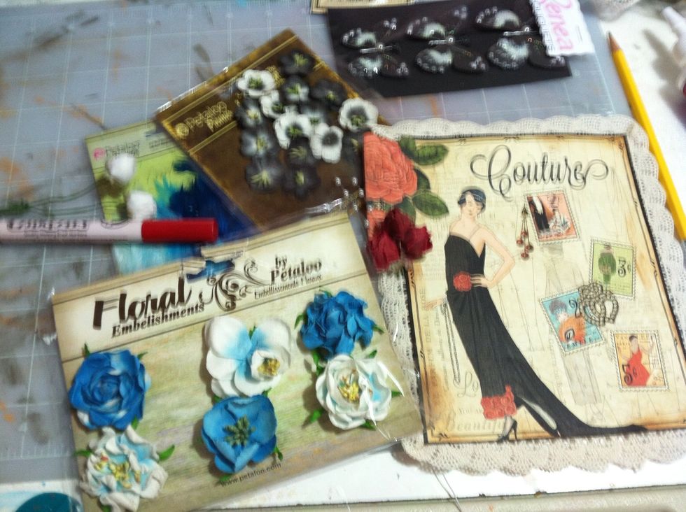 I used mostly Petaloo flowers to embellish however, I wanted Red Roses so I used a permanent red marker to color white Darice roses red. I felt a little like Alice in Wonderland.