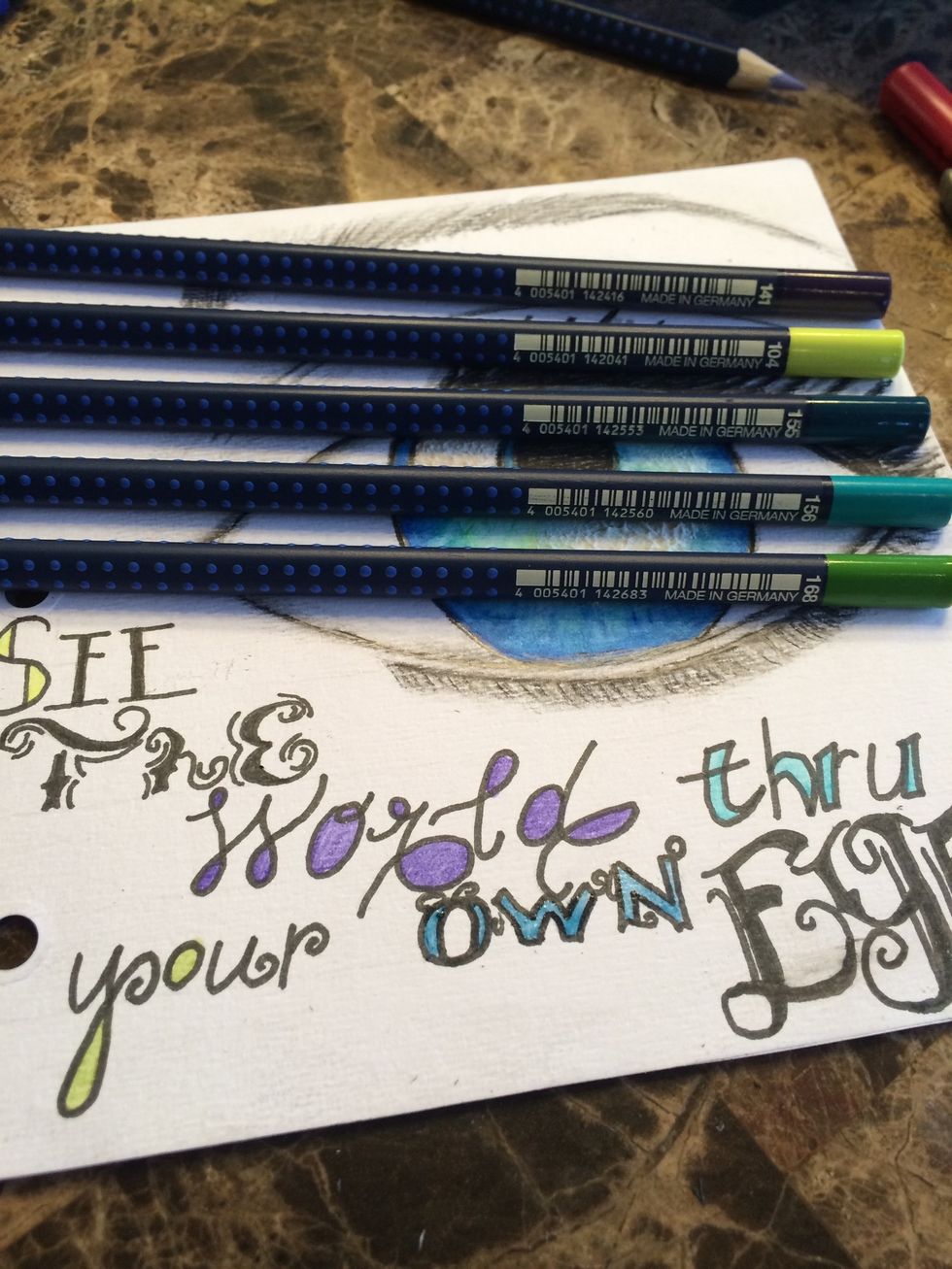 I used my PITT (R) Artist Pen in Brush Point (Black) to outline my letters, erased my pencil marks & filled them in with Art Grip (R) Aquarelle Watercolor Pencils #141, 104, 155, 156, & 168.