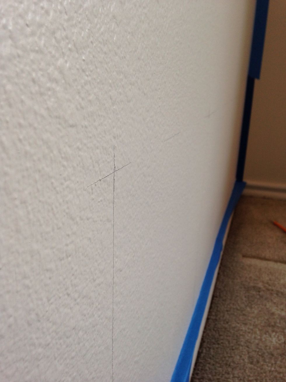 I used my ruler to mark points of intersect every 12 inches wide and 12 inches high. The points will serve as guides to ensure a straight line.