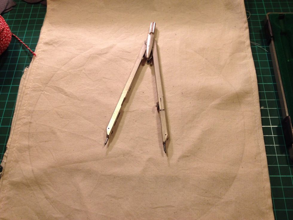 I used pair of compasses to make two semicircles. If you don't have any use a plate.